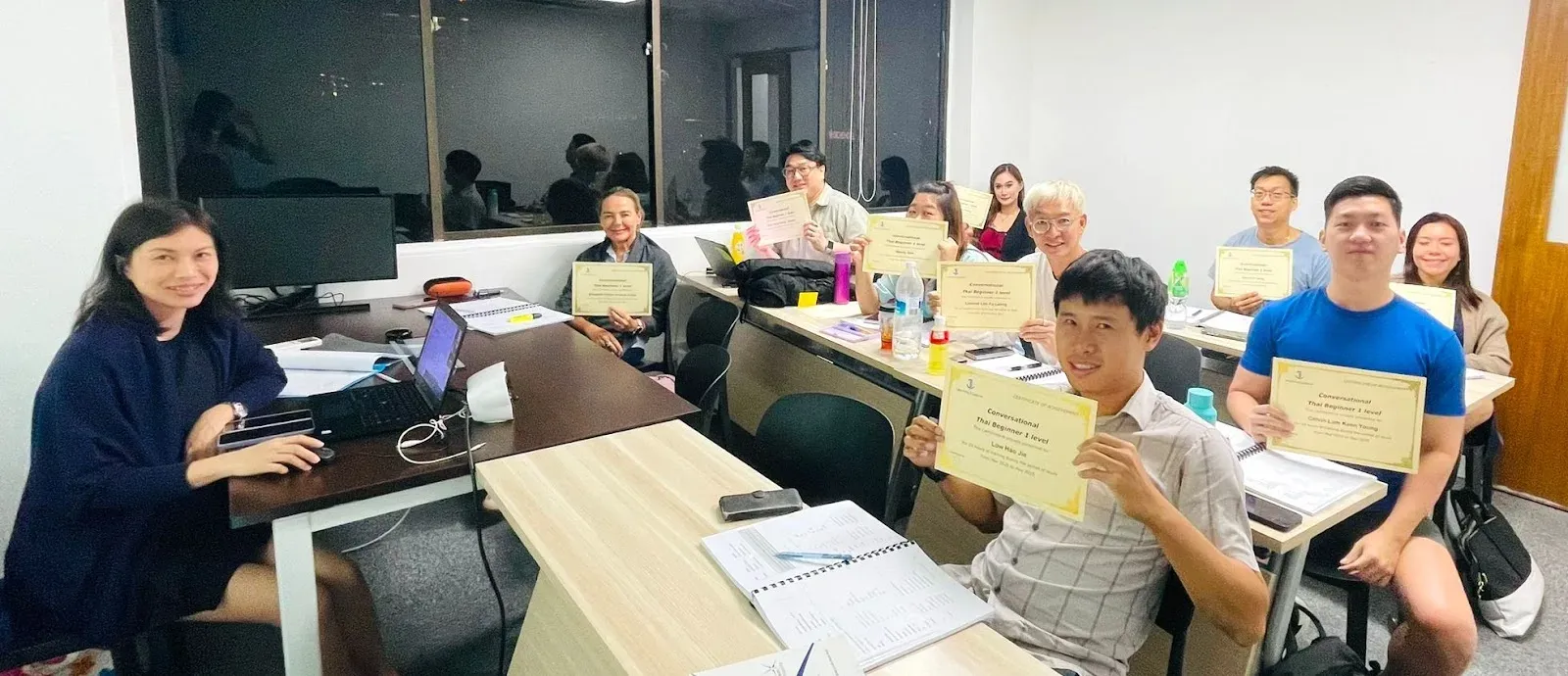 A Thai class at their desks on the final lesson